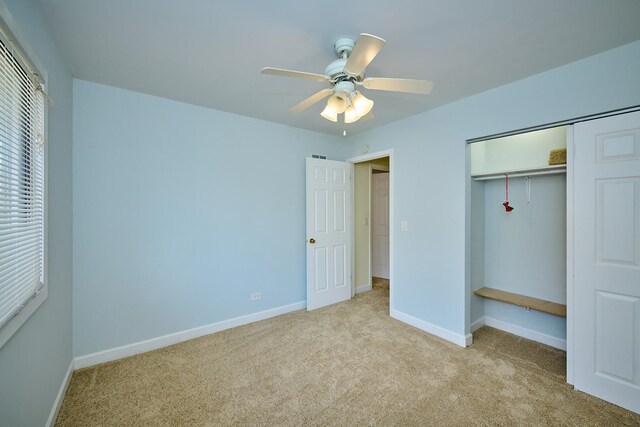 6256 Kit Carson Dr Unit 6256, Hanover Park, IL 60133 - unfurnished bedroom featuring carpet flooring, baseboards, a closet, and ceiling fan