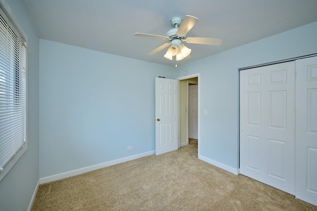 6256 Kit Carson Dr Unit 6256, Hanover Park, IL 60133 - unfurnished bedroom with light colored carpet, baseboards, a closet, and a ceiling fan