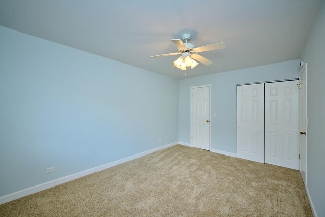 6256 Kit Carson Dr Unit 6256, Hanover Park, IL 60133 - unfurnished bedroom with carpet floors, baseboards, and a ceiling fan