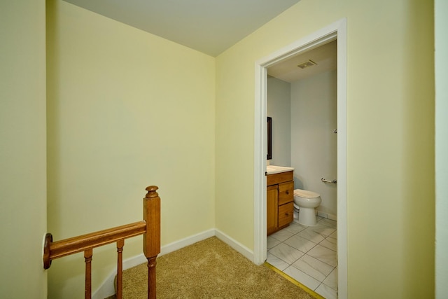 6256 Kit Carson Dr Unit 6256, Hanover Park, IL 60133 - hall with an upstairs landing, light carpet, baseboards, and light tile patterned floors
