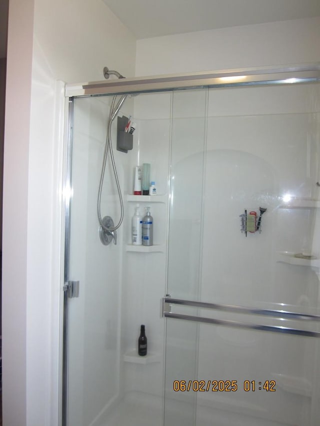 553 Hemmingsen St, Plano, IL 60545 - bathroom featuring a stall shower