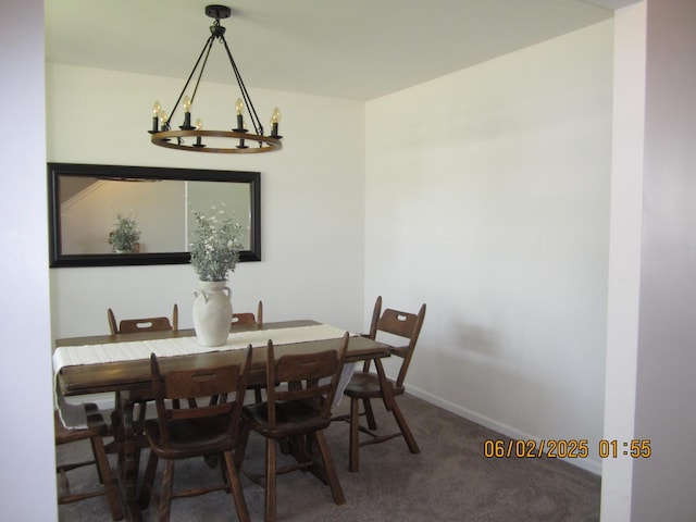 553 Hemmingsen St, Plano, IL 60545 - dining area featuring carpet flooring, a chandelier, and baseboards