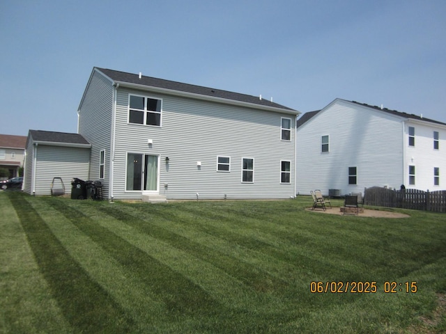 553 Hemmingsen St, Plano, IL 60545 - back of property with an outdoor fire pit and cooling unit