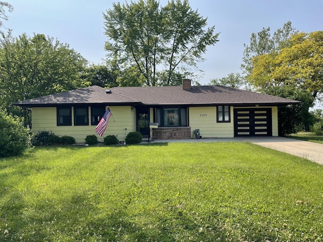 2009 Boehme St, Lockport, IL 60441 - view of front of house featuring a garage, a front yard, a chimney, and driveway