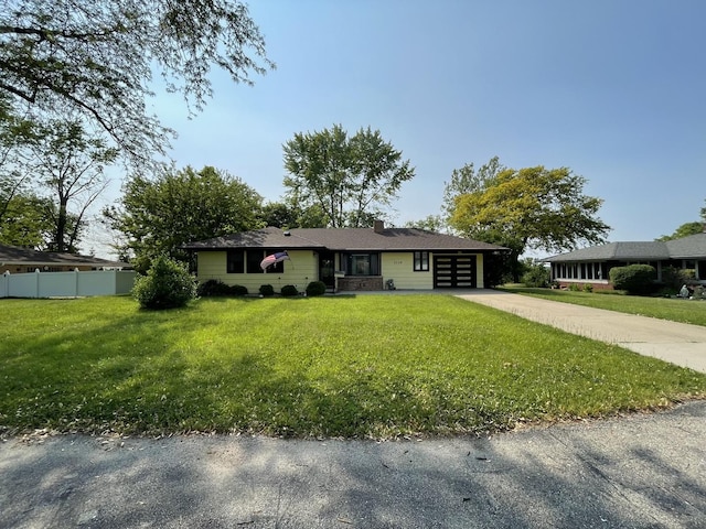 2009 Boehme St, Lockport, IL 60441 - single story home with an attached garage, driveway, and a chimney
