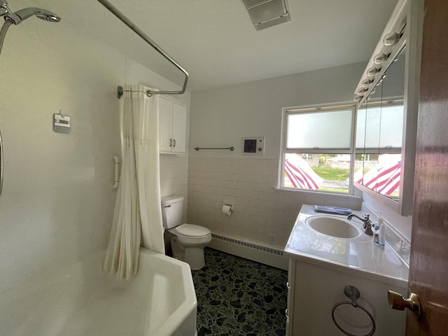 2009 Boehme St, Lockport, IL 60441 - full bathroom featuring a baseboard heating unit, toilet, vanity, curtained shower, and tile walls