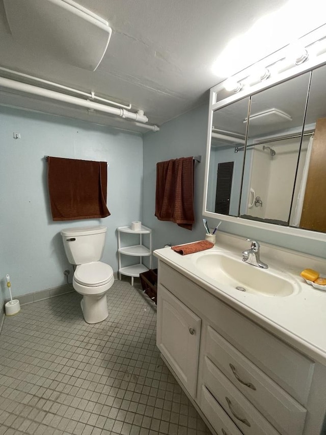 2009 Boehme St, Lockport, IL 60441 - full bathroom featuring vanity, toilet, baseboards, and tile patterned floors