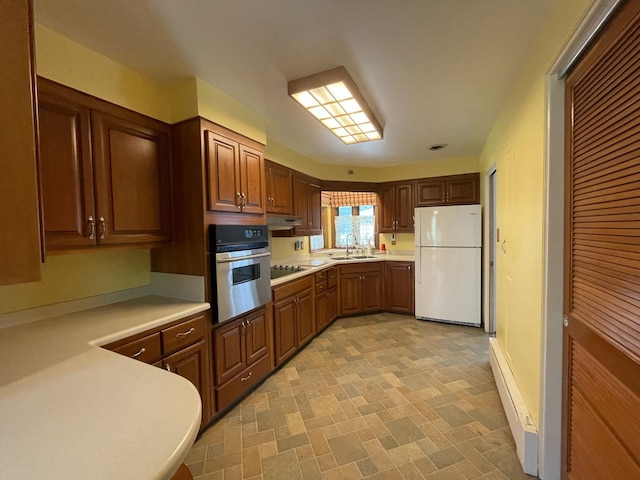 2009 Boehme St, Lockport, IL 60441 - kitchen featuring freestanding refrigerator, stainless steel oven, a sink, light countertops, and black electric cooktop
