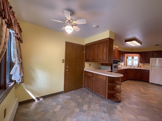 2009 Boehme St, Lockport, IL 60441 - kitchen featuring freestanding refrigerator, open shelves, light countertops, and a baseboard radiator