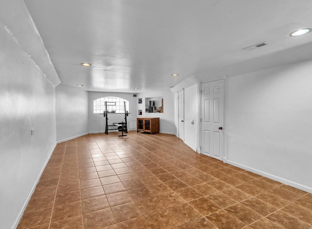 2822 N 76th Ct, Elmwood Park, IL 60707 - unfurnished living room with recessed lighting, arched walkways, baseboards, and tile patterned flooring