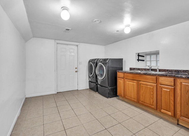 2822 N 76th Ct, Elmwood Park, IL 60707 - laundry area with washing machine and dryer, light tile patterned floors, baseboards, and cabinet space