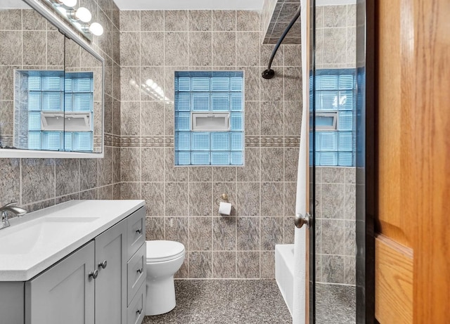 2822 N 76th Ct, Elmwood Park, IL 60707 - full bath featuring vanity, tile walls, toilet, bathing tub / shower combination, and healthy amount of natural light