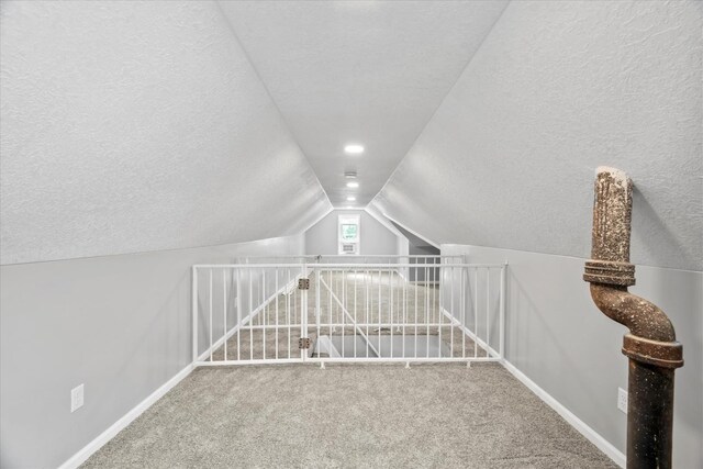 752 N 9th Ave, Kankakee, IL 60901 - playroom featuring carpet, lofted ceiling, a textured ceiling, and baseboards