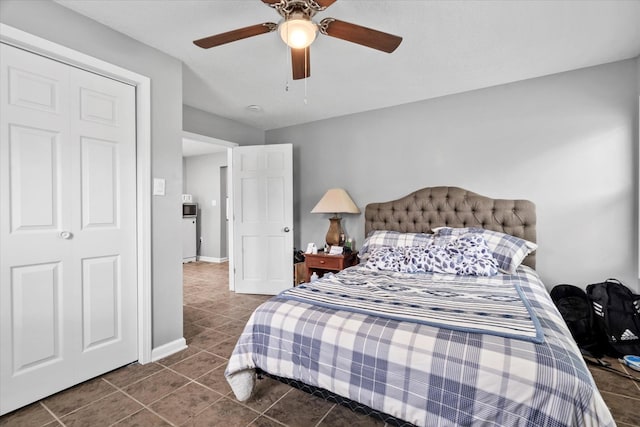 752 N 9th Ave, Kankakee, IL 60901 - bedroom featuring dark tile patterned floors, a ceiling fan, and baseboards