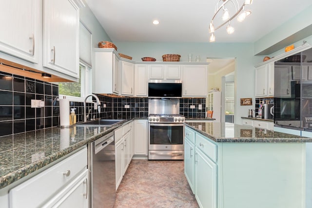 3518 Matisse Dr, Saint Charles, IL 60175 - kitchen with appliances with stainless steel finishes, backsplash, a center island, white cabinetry, and recessed lighting