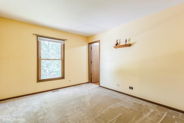 1029 Rain Tree Dr, Bolingbrook, IL 60440 - spare room with light carpet and baseboards