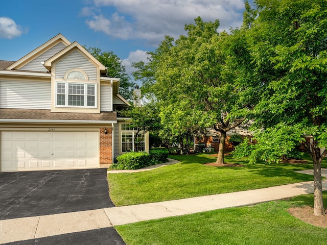 2349 County Farm Ln, Schaumburg, IL 60194 - view of front of property with a garage, asphalt driveway, a front lawn, brick siding, and roof with shingles