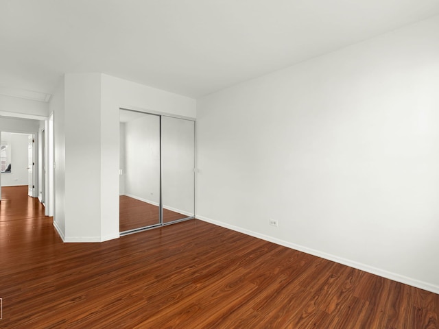 2349 County Farm Ln, Schaumburg, IL 60194 - unfurnished bedroom with a closet and dark wood-style floors