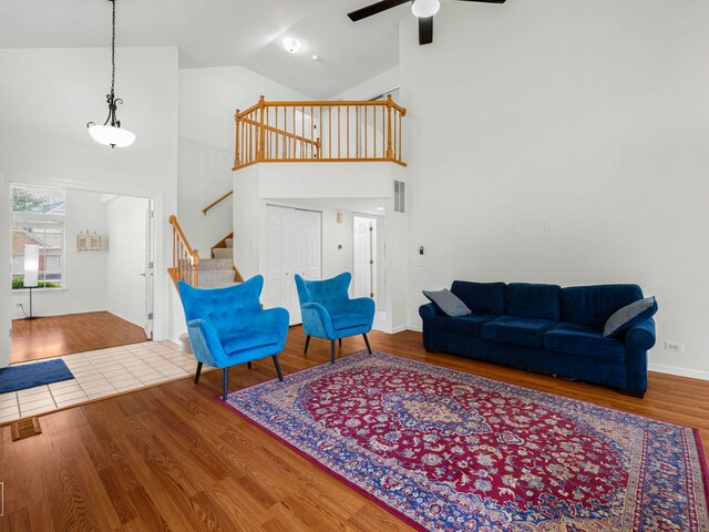 2349 County Farm Ln, Schaumburg, IL 60194 - living area with high vaulted ceiling, ceiling fan, stairs, and wood finished floors