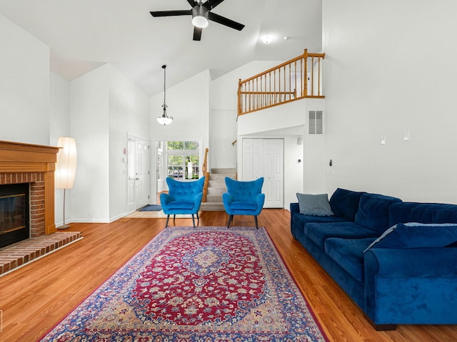 2349 County Farm Ln, Schaumburg, IL 60194 - living room with high vaulted ceiling, ceiling fan, a fireplace, and wood finished floors