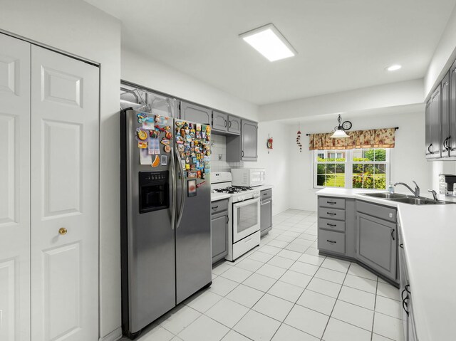 2349 County Farm Ln, Schaumburg, IL 60194 - kitchen with white appliances, gray cabinets, light countertops, light tile patterned floors, and recessed lighting