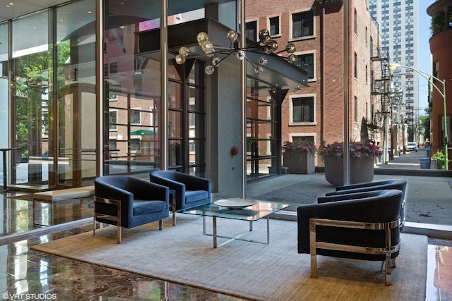 1 E Schiller St Unit 10B, Chicago, IL 60610 - common area with a towering ceiling, floor to ceiling windows, and a view of city