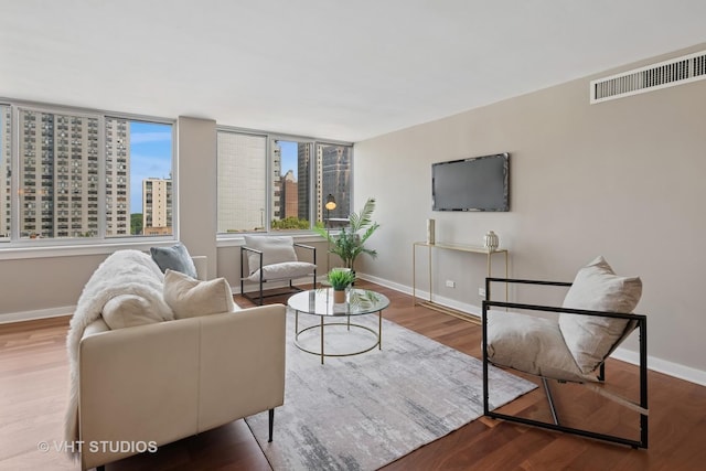1 E Schiller St Unit 10B, Chicago, IL 60610 - living area featuring baseboards and wood finished floors