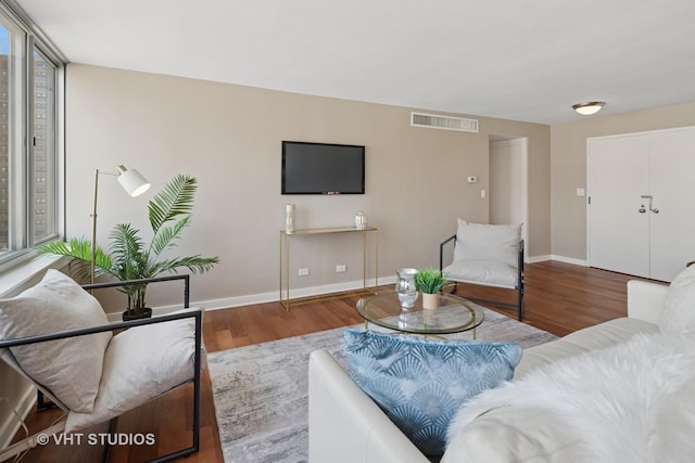 1 E Schiller St Unit 10B, Chicago, IL 60610 - living room featuring wood finished floors and baseboards