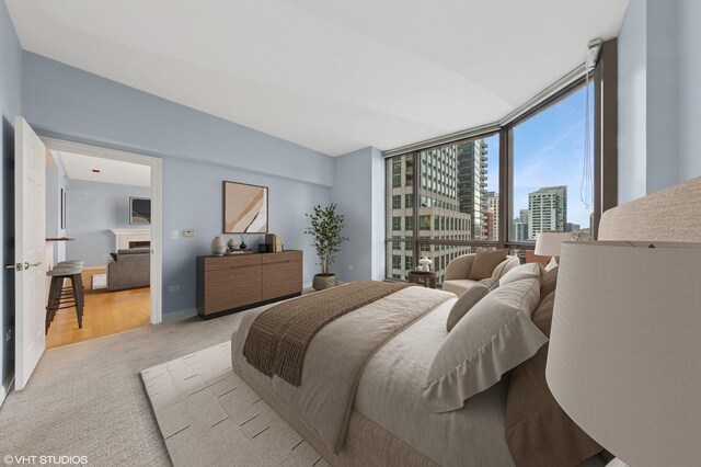 21 E Huron St Unit 1101, Chicago, IL 60611 - bedroom featuring light colored carpet and a wall of windows