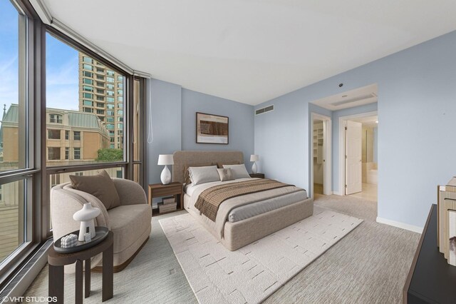 21 E Huron St Unit 1101, Chicago, IL 60611 - carpeted bedroom featuring expansive windows and baseboards