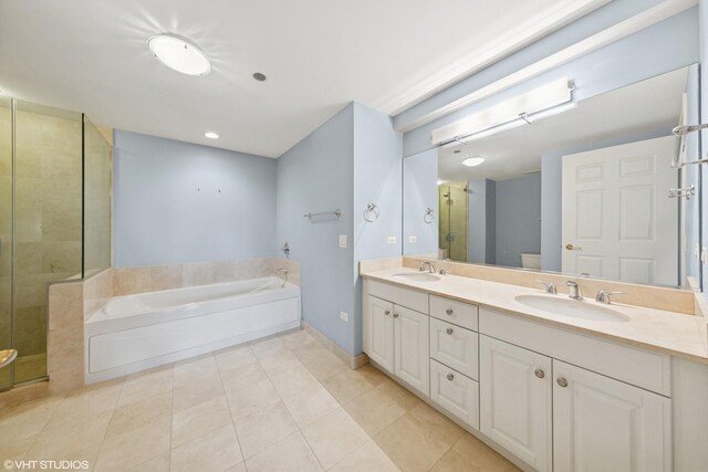 21 E Huron St Unit 1101, Chicago, IL 60611 - full bath featuring a garden tub, double vanity, tile patterned flooring, a shower stall, and baseboards