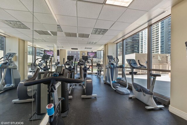 21 E Huron St Unit 1101, Chicago, IL 60611 - workout area featuring plenty of natural light, a paneled ceiling, and a wall of windows
