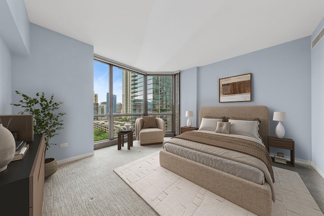 21 E Huron St Unit 1101, Chicago, IL 60611 - bedroom with a wall of windows, a view of city, carpet, and baseboards