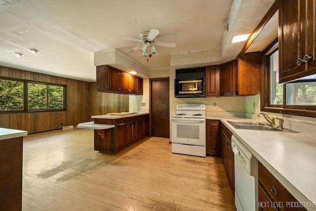 4N194 Thornly Rd, Saint Charles, IL 60174 - kitchen with white appliances, light wood-type flooring, a ceiling fan, light countertops, and plenty of natural light