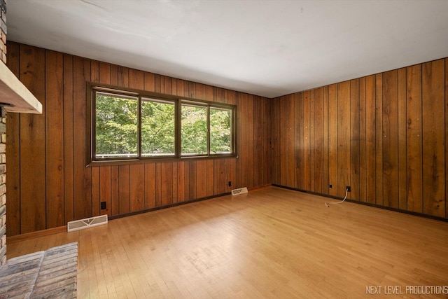4N194 Thornly Rd, Saint Charles, IL 60174 - spare room with light wood-type flooring and wood walls