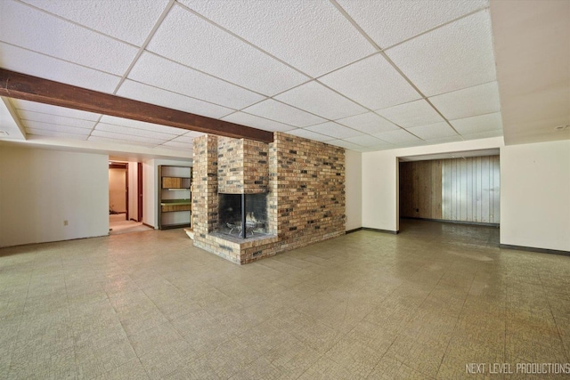 4N194 Thornly Rd, Saint Charles, IL 60174 - unfurnished living room with a paneled ceiling, a fireplace, and tile patterned floors