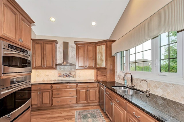 20400 Mackinac Point Dr, Frankfort, IL 60423 - kitchen with wall chimney exhaust hood, stainless steel appliances, brown cabinets, dark stone countertops, and lofted ceiling