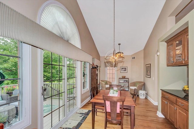 20400 Mackinac Point Dr, Frankfort, IL 60423 - dining room with a chandelier, light wood-style floors, and high vaulted ceiling