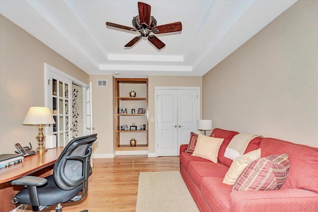 20400 Mackinac Point Dr, Frankfort, IL 60423 - office area featuring a tray ceiling, ceiling fan, light wood finished floors, and french doors