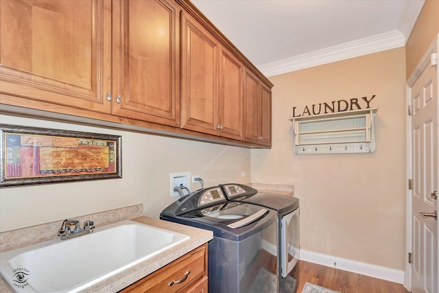 20400 Mackinac Point Dr, Frankfort, IL 60423 - laundry room with washer and clothes dryer, cabinet space, crown molding, and wood finished floors
