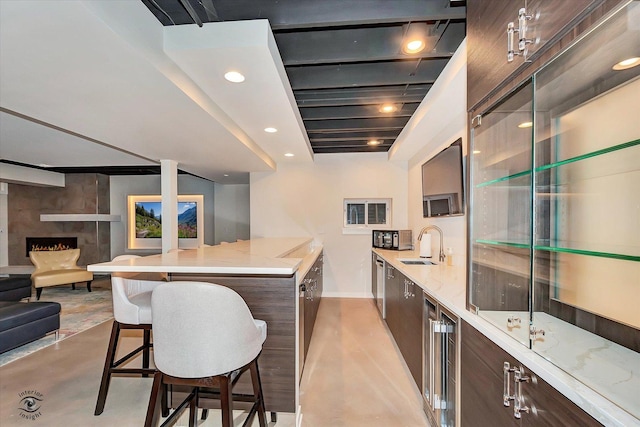 20400 Mackinac Point Dr, Frankfort, IL 60423 - kitchen featuring modern cabinets, dark brown cabinetry, finished concrete flooring, open floor plan, and recessed lighting