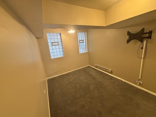 1430 E 69th St Unit 1S, Chicago, IL 60637 - below grade area featuring a baseboard radiator, ceiling fan, carpet floors, and baseboards