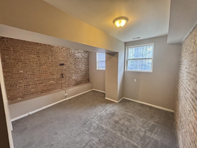 1430 E 69th St Unit 1S, Chicago, IL 60637 - basement with carpet floors, baseboards, and brick wall