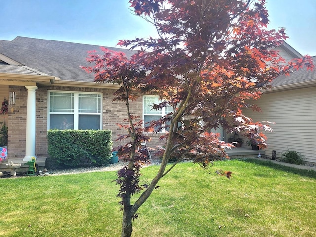 626 Sedgegrass Dr, Champaign, IL 61822 - view of side of home with a yard, roof with shingles, and brick siding