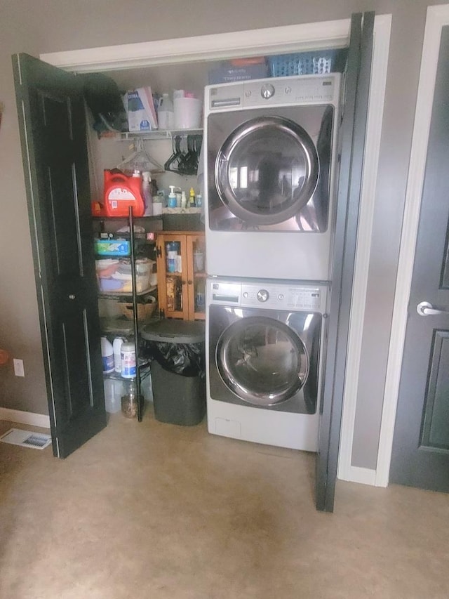 626 Sedgegrass Dr, Champaign, IL 61822 - laundry area with estacked washer and dryer