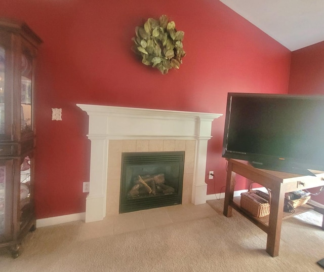 626 Sedgegrass Dr, Champaign, IL 61822 - carpeted living area with a tile fireplace, lofted ceiling, and baseboards