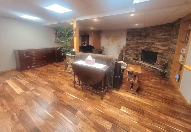 626 Sedgegrass Dr, Champaign, IL 61822 - living area with wood finished floors, a stone fireplace, and recessed lighting