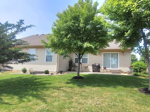 626 Sedgegrass Dr, Champaign, IL 61822 - rear view of house featuring a yard and a patio
