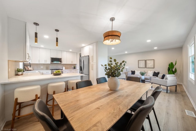 21W040 Monticello Rd, Lombard, IL 60148 - dining space featuring light wood-type flooring, recessed lighting, and baseboards