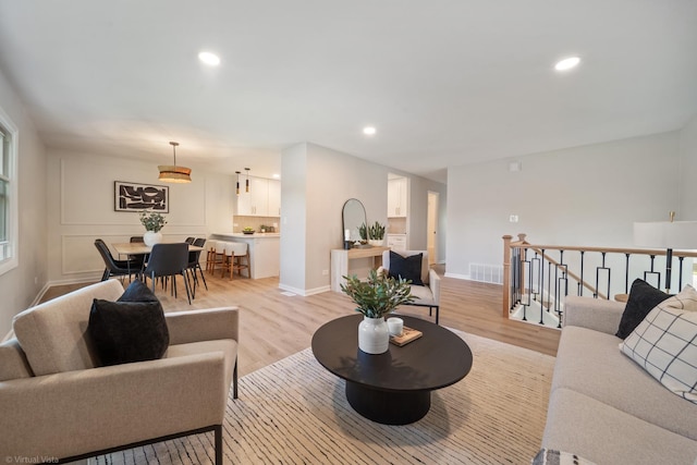 21W040 Monticello Rd, Lombard, IL 60148 - living area featuring light wood finished floors, recessed lighting, and baseboards